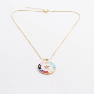 Macro shot of colorful enamel star pendant necklace with cubic zirconia details