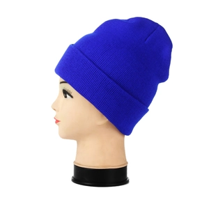 Detailed close-up of dark blue ribbed knit beanie on model head for winter warmth
