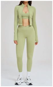 Three-piece yoga set with zip jacket, V-neck top, and high-waisted leggings in sage green