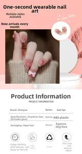 Detail view of pink gradient press-on nails with 3D bows and heart crystal accents