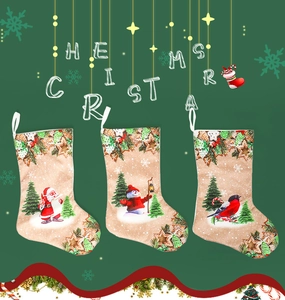 Detailed view of three Christmas stockings with Santa, Snowman and Red Bird patterns