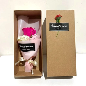 Detail of a gift box featuring a bouquet of pink soap roses and carnations for Mother's Day