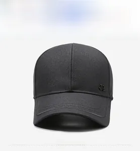 Detail shot of a black baseball cap featuring a premium dark gray metal JB logo on the side