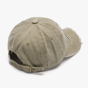 Vintage khaki canvas baseball cap with distressed details and adjustable metal buckle