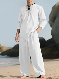 Men's white linen resort set with long-sleeved mandarin collar shirt and loose trousers