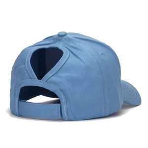 Detail of sky blue cotton ponytail baseball cap featuring cross-strap hair hole and velcro strap