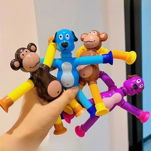 Close-up of luminous suction cup giraffe telescopic tube toy showing glowing stretchable limbs