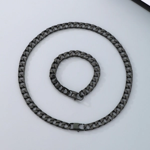 Detail of black stainless steel Cuban link necklace and bracelet set with lobster clasps
