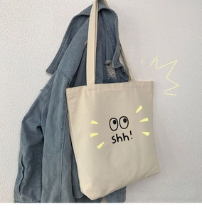 Detalle del bolso tote de lona con textura gruesa y diseño de ojos de dibujos animados Shh!