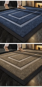 Detailed texture of blue and brown rubber entryway mats with geometric patterns