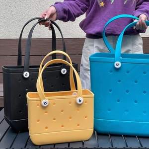 Detailed close-up of colorful waterproof EVA beach bags in blue and yellow with hole design