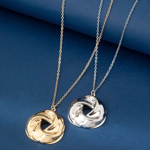 Minimalist twisted circle pendant necklace in gold and silver polished metal finishes
