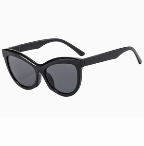 Detailed 45-degree side view of black cat-eye sunglasses with dark grey lenses