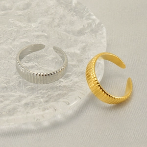 Minimalist geometric textured open rings in gold and silver finish with vertical stripes