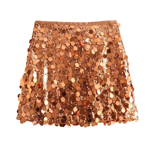 Detailed close-up of rose gold sequin mini skirt showing texture and metallic finish