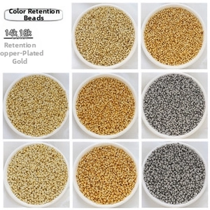 Detailed macro view of 18k gold plated triangle spacer beads for DIY jewelry making