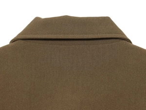 Detail of tan bomber jacket collar showing smooth texture and high-quality stitching