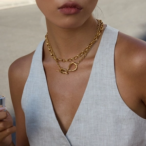 Detail of 18K gold-plated stainless steel double-layered chain necklace with OT clasp