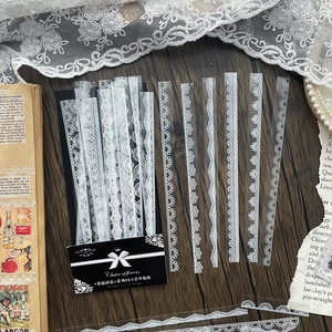 Vintage white lace PET stickers set with floral patterns for journals on a wooden desk