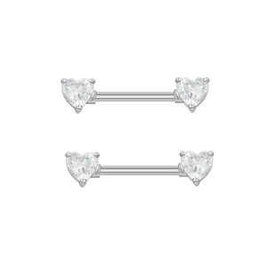 Macro detail of silver heart nipple rings with sparkling white rhinestones on white background