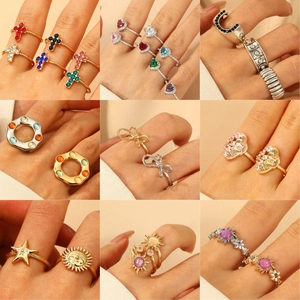 Chic ring set featuring cross, heart, and sunflower designs in gold and silver plating