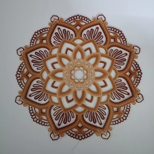 Detailed close-up of multilayered mandala night light with intricate cutout patterns