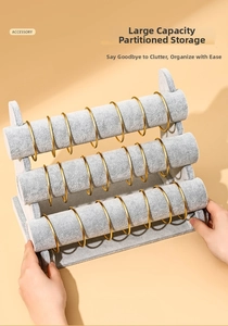 Three-tier gray velvet jewelry stand for bracelets and watches with a tiered display design