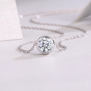 Polished S925 sterling silver necklace featuring a brilliant round moissanite pendant