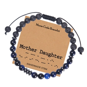 Morse Code mother daughter bracelet on kraft card with blue beads and lava stone