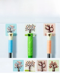Strong adhesive wall hooks with colorful tree patterns for tool storage in kitchens