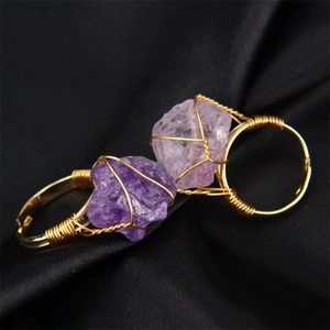 Handmade amethyst crystal raw stone gold wire wrapped adjustable rings on black satin