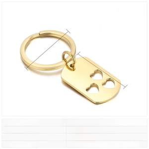 Polished gold stainless steel rectangular keychain with three cutout heart patterns
