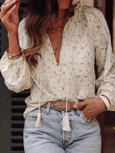 Elegant floral lace-up shirt with bohemian tassel details and long sleeves for women
