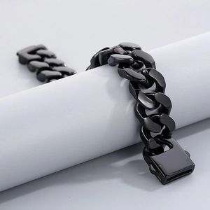 Macro view of 20mm polished black stainless steel Cuban link bracelet for men