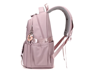 Detail view of pink travel backpack featuring adjustable honeycomb mesh shoulder straps