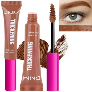 Detailed view of brown brow mascara with fiber brush applicator and swatch effects