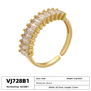 Detail view of adjustable gold-plated brass ring with rectangle-cut zircon stones