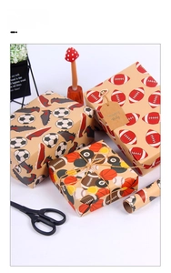 Macro view of kraft gift wrapping paper featuring vintage soccer and basketball patterns