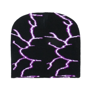 Close-up of black knitted beanie featuring purple and white lightning bolt pattern texture
