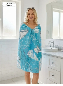 Detail view of large blue beach towel with seashell print worn as a wrap in a bathroom