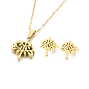Golden Tree of Life necklace and earrings set in stainless steel on white background