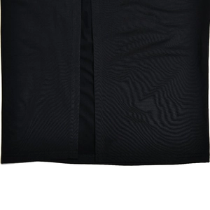Macro shot of fine knit black fabric texture with a side slit detail on dress