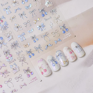 3D laser bow nail stickers with sparkling crystals and cherry accents for manicure