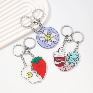 Acrylic magnetic heart keychains with daisy, strawberry egg and drink motifs on white wavy tray