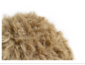 Close-up of soft light brown faux fur texture on a plush knit beanie hat for winter