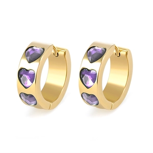 Detailed view of gold huggie earrings featuring three purple heart-shaped zircon stones