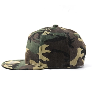 Detail of woodland camouflage snapback hat with flat brim and gold logo sticker