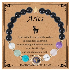 Aries blue sandstone beaded bracelet with natural crystals and star charm on gift card