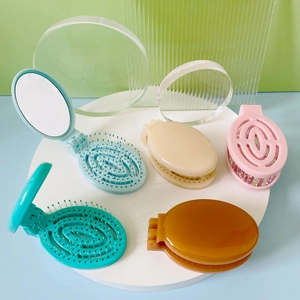 Portable folding hairbrush with mirror in multiple colors for travel and home use