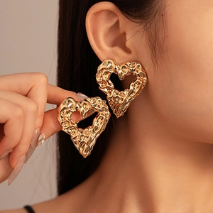 Gold heart earrings with hollow lava texture and metallic fold design for women